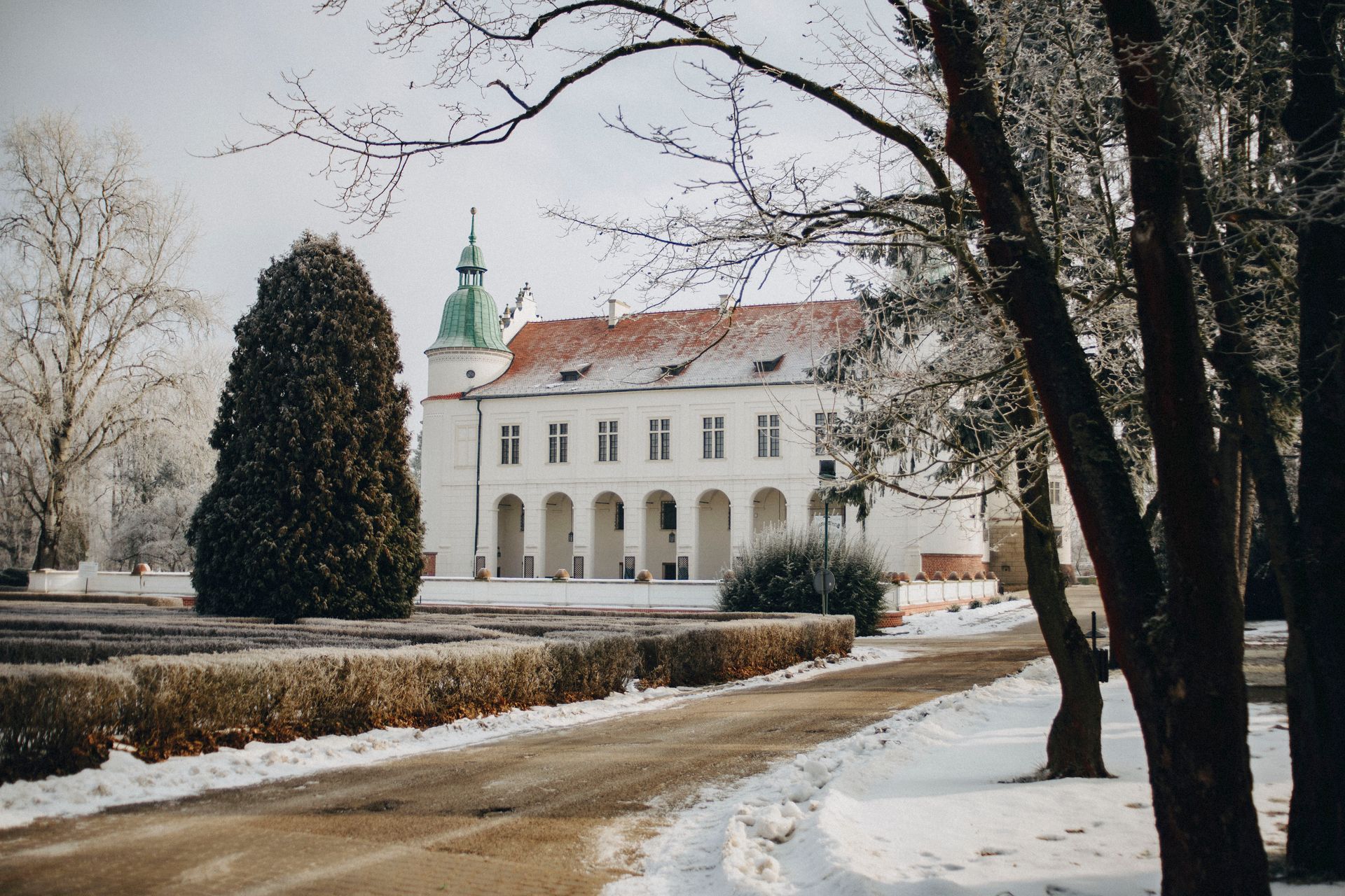 Snowy landscape of the Baranów Sandomierski Castle in Poland during winter.