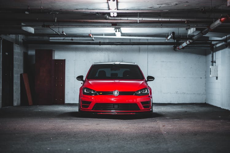 Red Car Parked In Garage