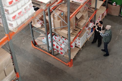 Men Standing in a Warehouse Talking