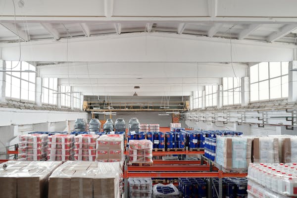 Wrapped stock material stored in a storage unit