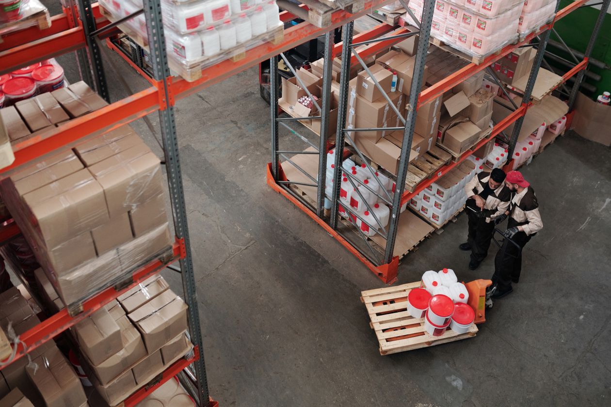 Logistics warehouse team coordinating inbound palletised shipments
