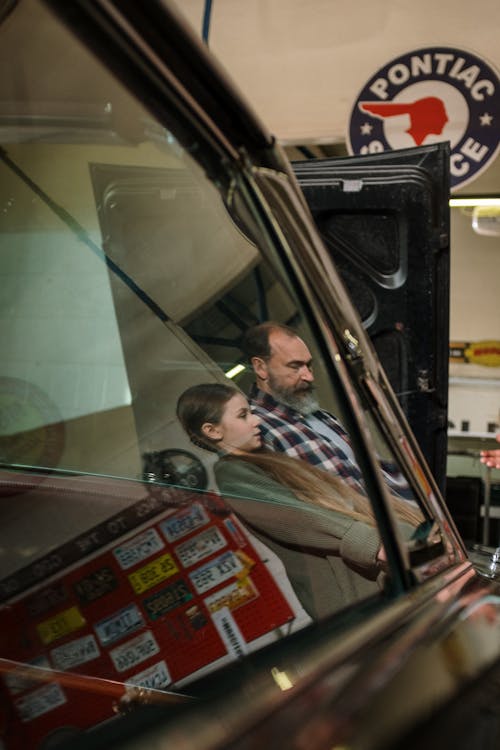 Free Father and Daughter Reflected on a Car Window  Stock Photo