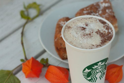 Shallow Focus Photo of Coffee in a Starbucks Cup