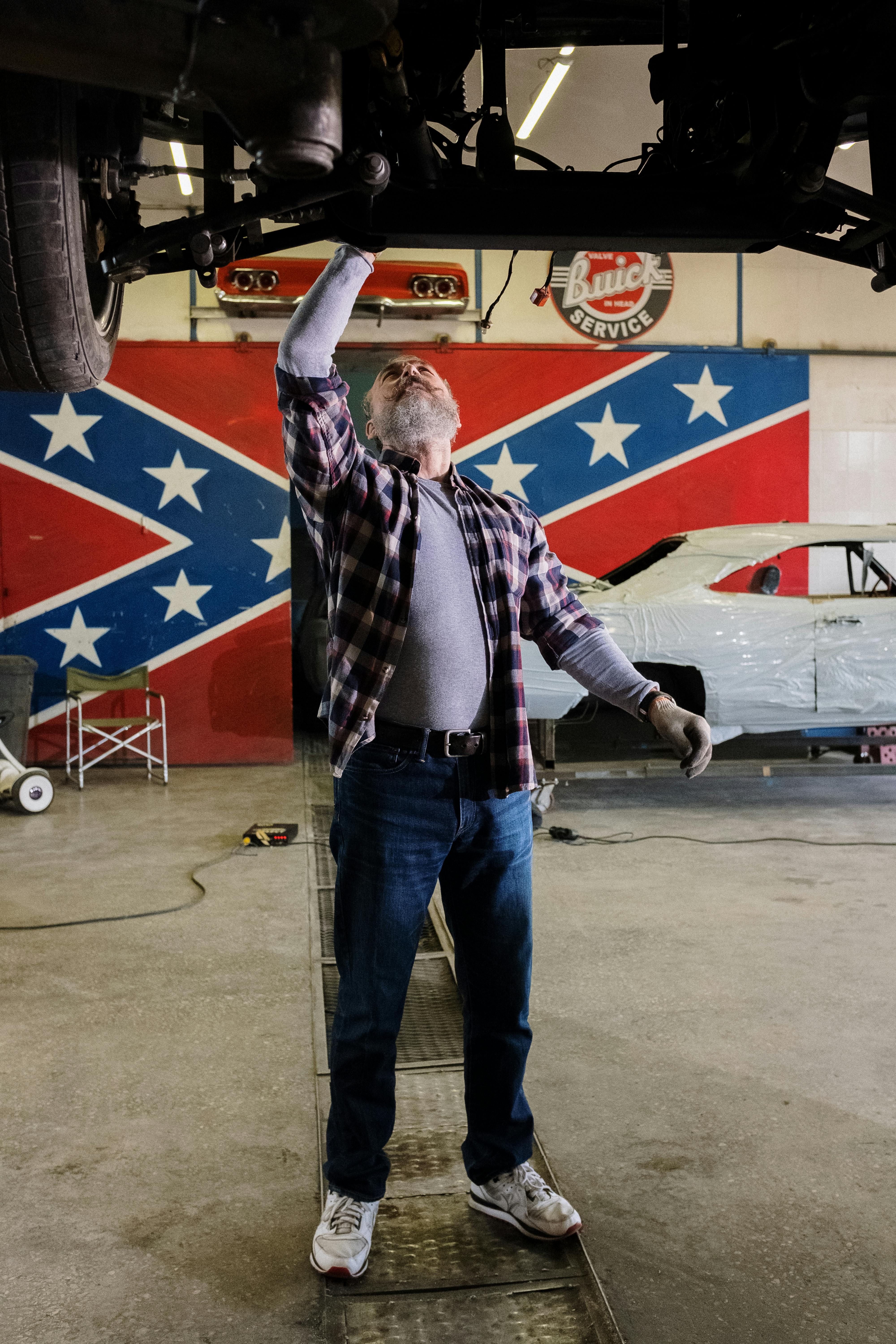 Gamers discussing a tabletop miniature battle around a gaming table