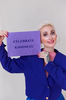 Woman in Blue Blazer Holding Brown Card