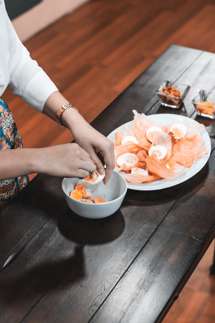 Cook Preparing Starter Food With Eggs And Salmon