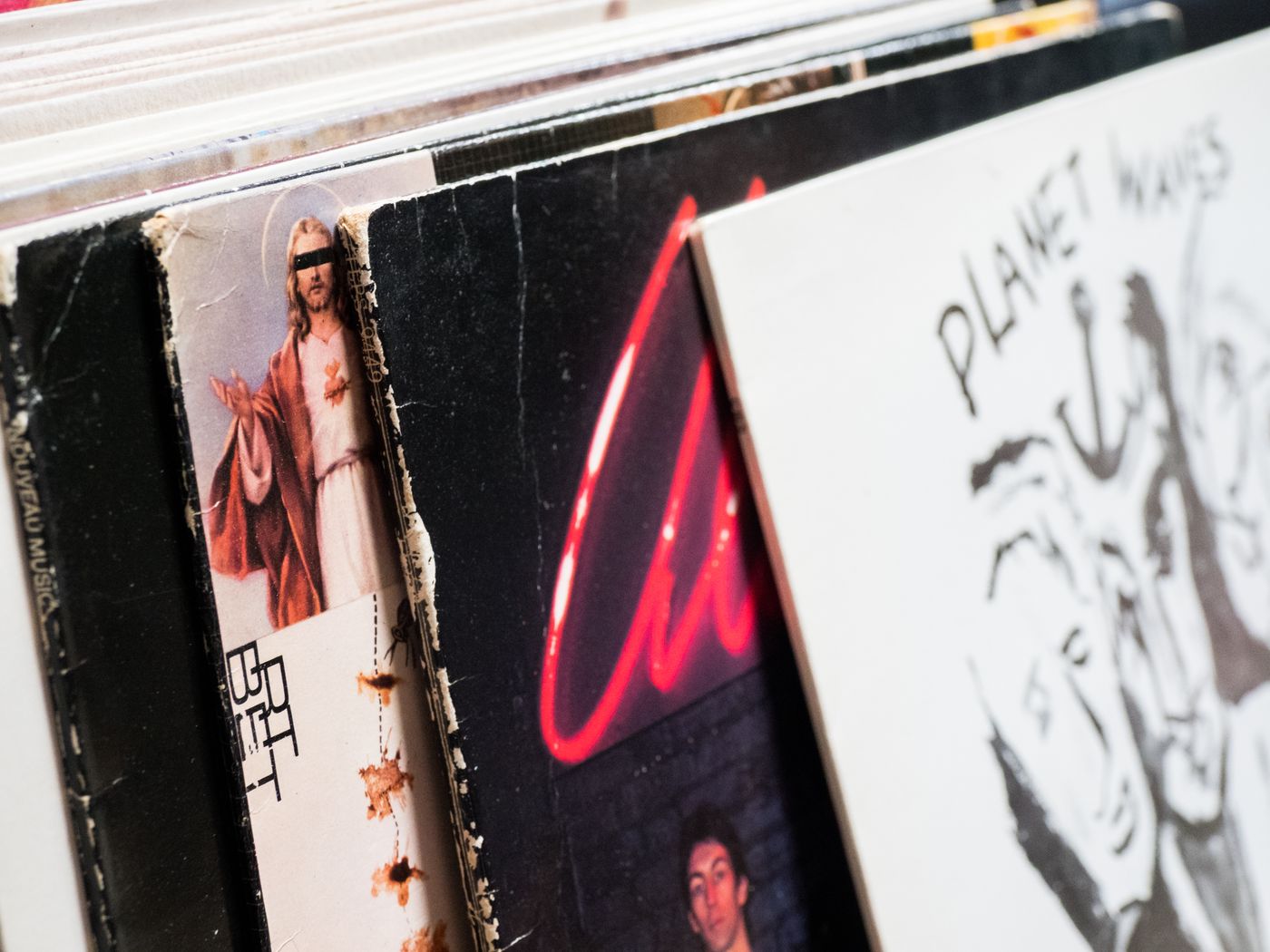Physical music albums displayed in a record shop