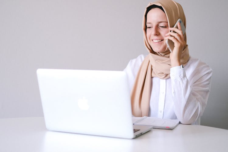 Woman In White Hijab Using Macbook