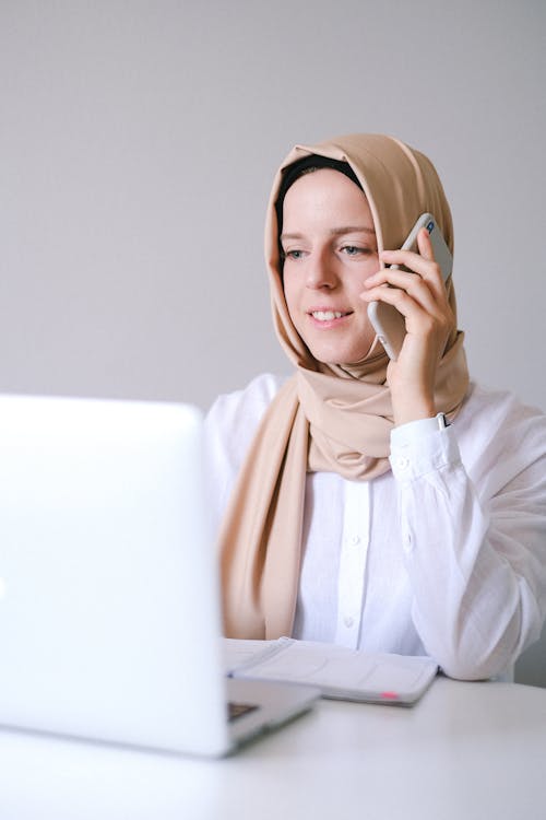 Free Woman in White Long Sleeve Shirt Wearing Brown Hijab Stock Photo