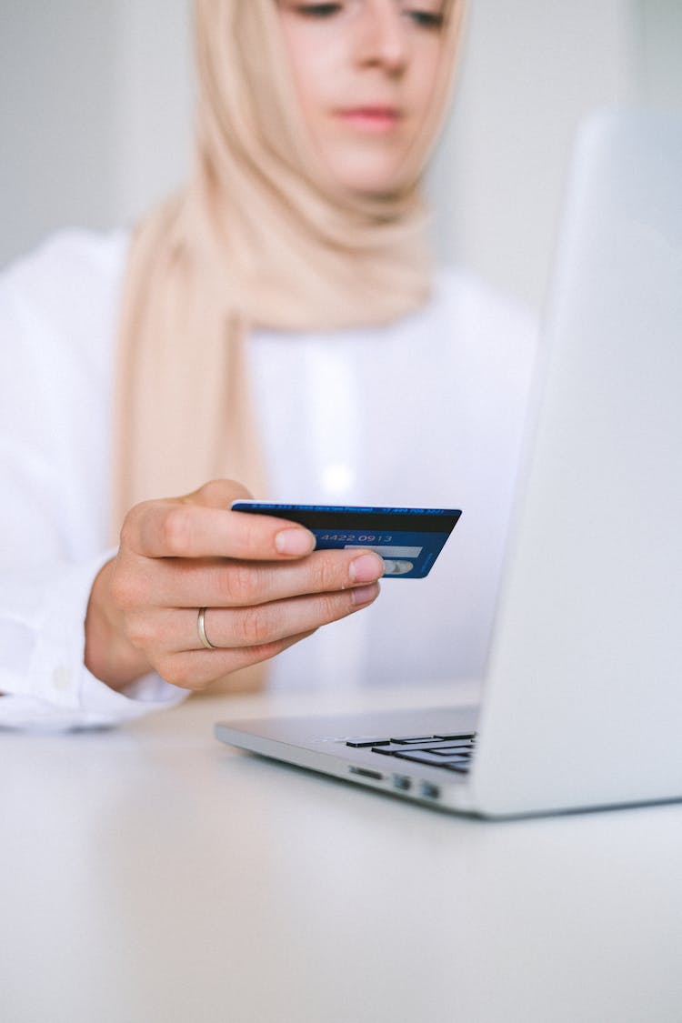 Woman Holding Bank Card