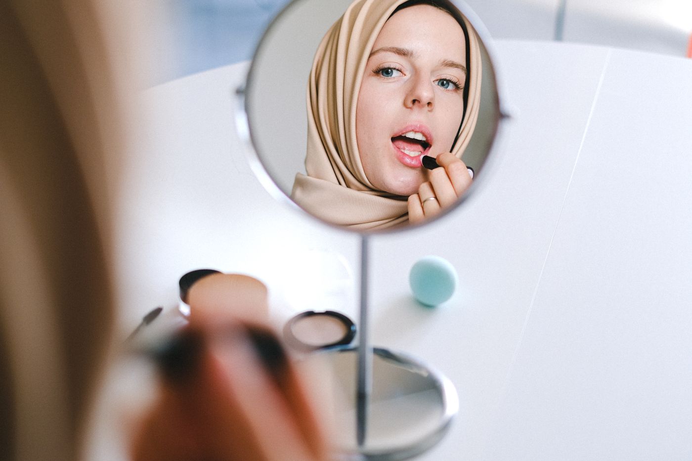 Woman applying beauty product