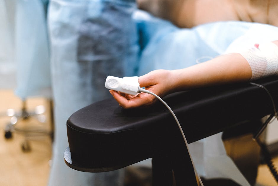 A close-up image of a patient's finger with a pulse oximeter attached, showing vital signs being monitored - sedation meaning A close-up image of a patient's finger with a pulse oximeter attached, showing vital signs being monitored - sedation meaning