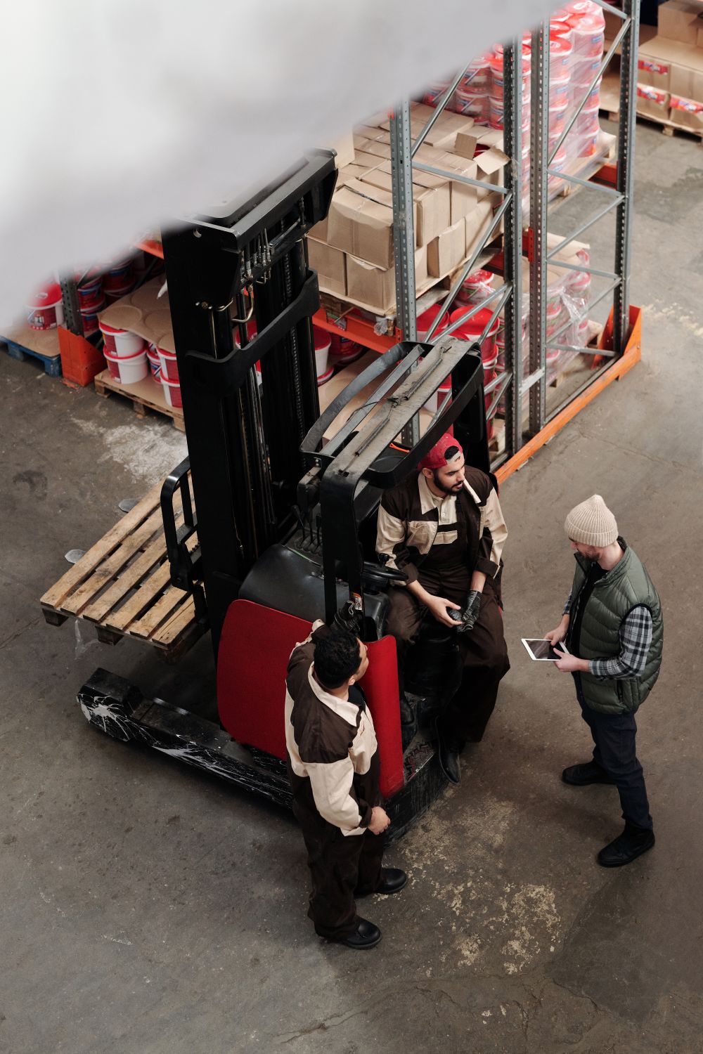 Warehouse workers coordinating freight movement