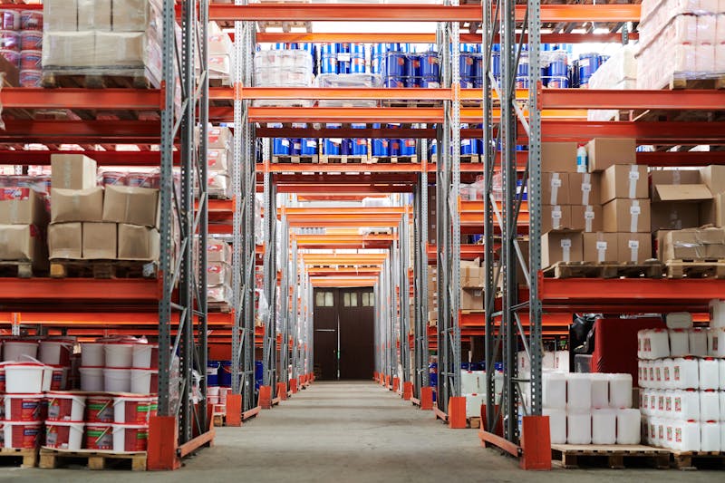 Palletised goods stacked in a logistics warehouse