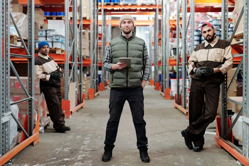 Warehouse Workers Standing in Corridor