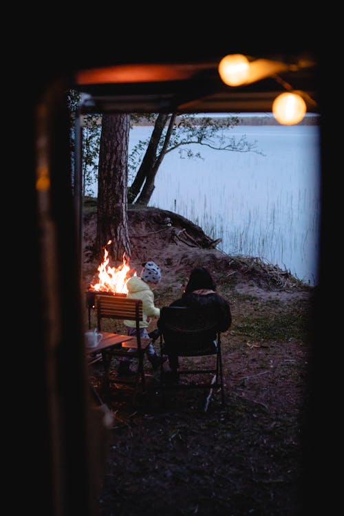 People Sitting Near a Bonfire