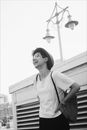 Grayscale Photo of Person in White Top Smiling
