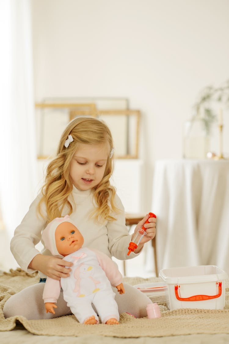 Girl Playing With Baby Doll