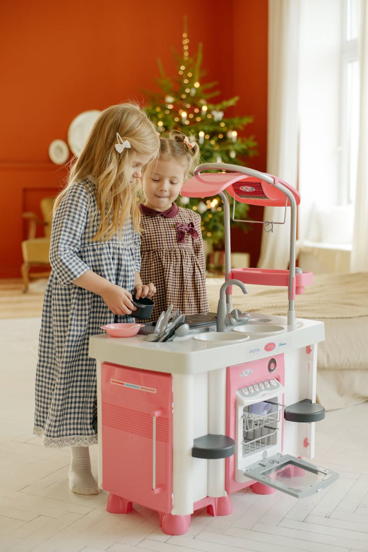 Photo Of Kids Playing With Kitchen Plastic Toy