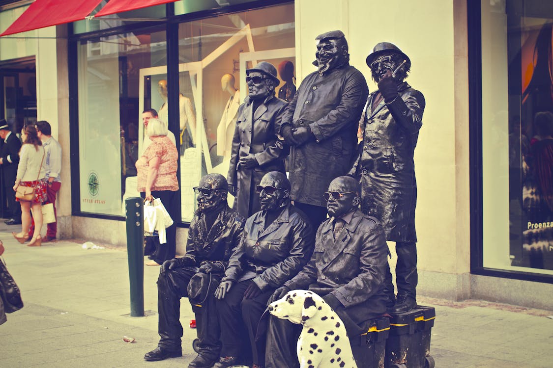 Free Six Soldier Statues Beside White Building Stock Photo