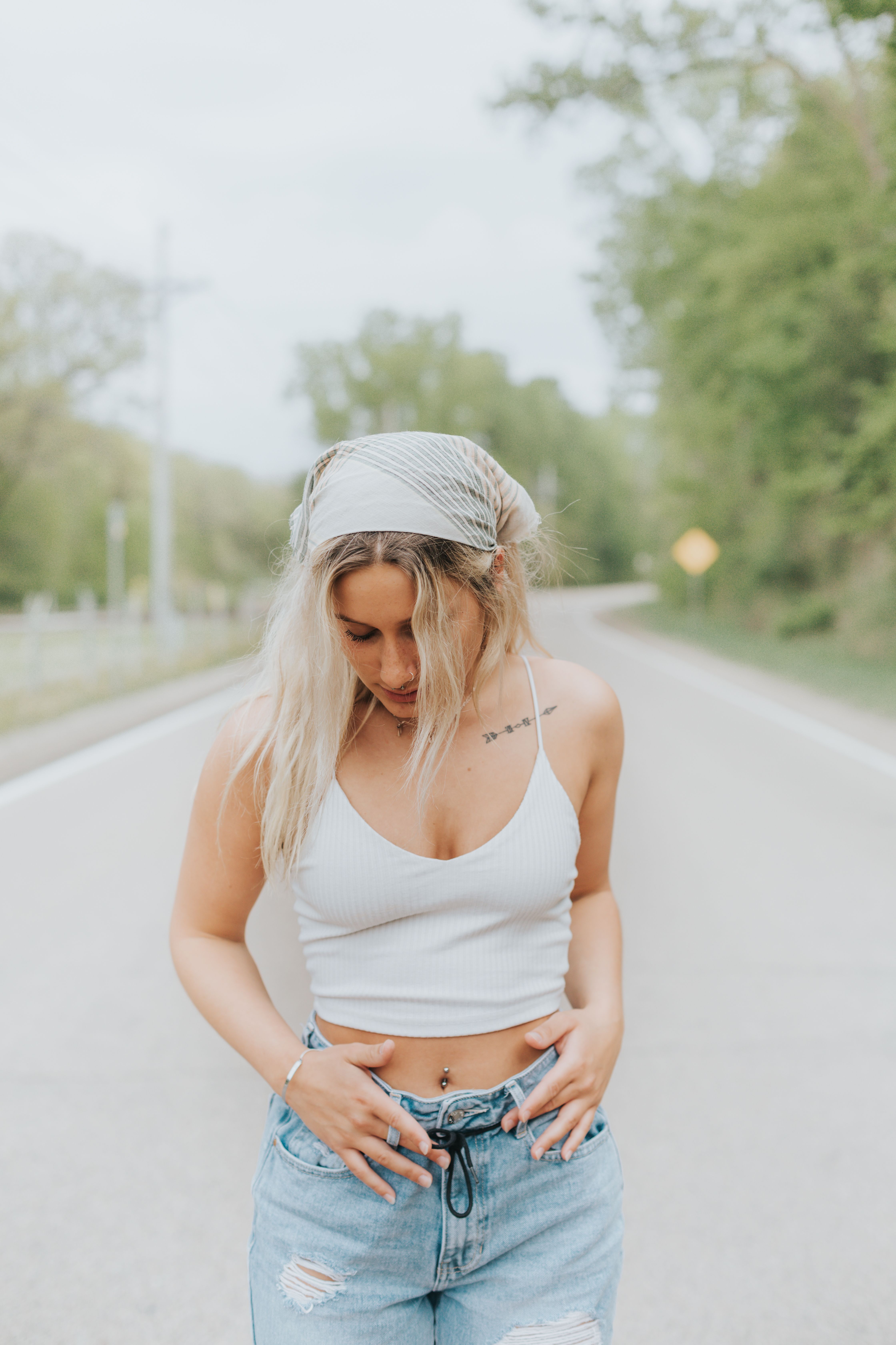 Woman Wearing White Tank Top and Blue Denim Jeans · Free Stock Photo