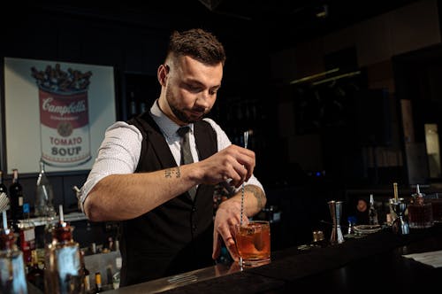Free Barman in Black Vest Making Cocktail Stock Photo