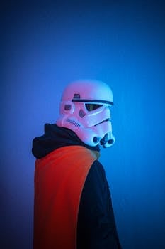 A person in a stormtrooper helmet poses with vivid lighting, highlighting sci-fi themes.