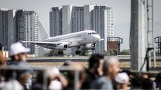 People Walking on the Street Near White Airplane