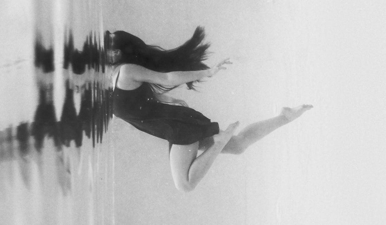Woman in Dress under Water
