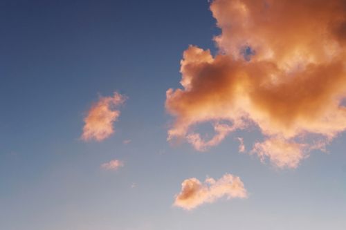 Free Breathtaking clouds illuminated by the sunset in the clear sky over Dnipro, Ukraine. Stock Photo