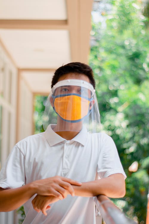 Free Man in White Polo Shirt Wearing Face Mask Stock Photo