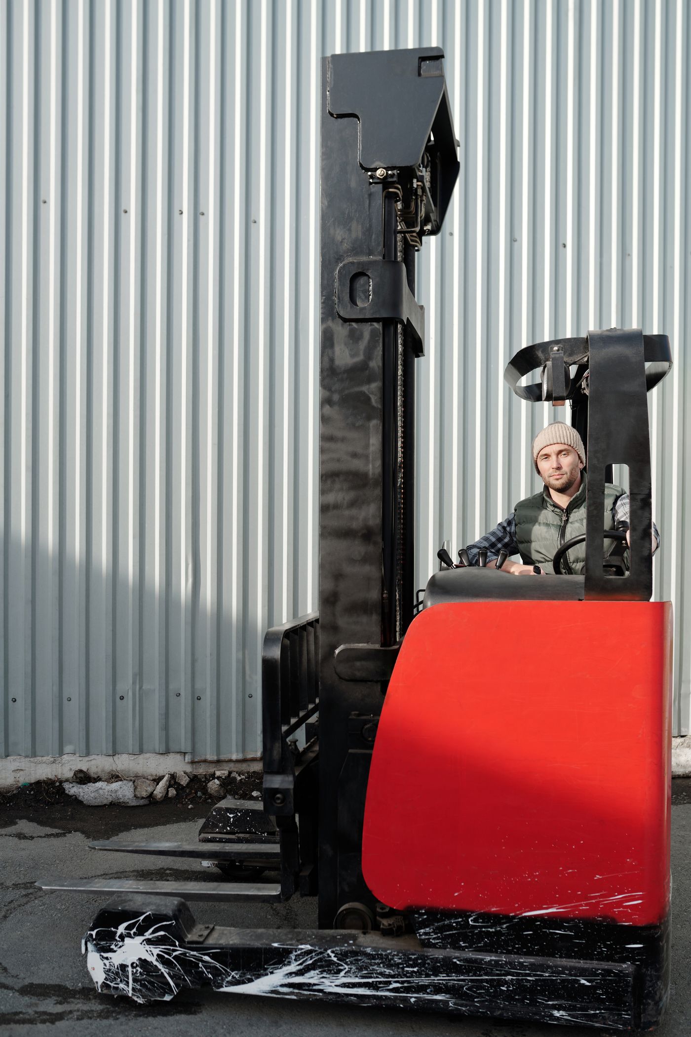 Forklift operator in industrial setting