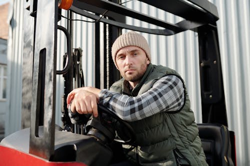 Free Operator Sitting Inside Forklift  Stock Photo