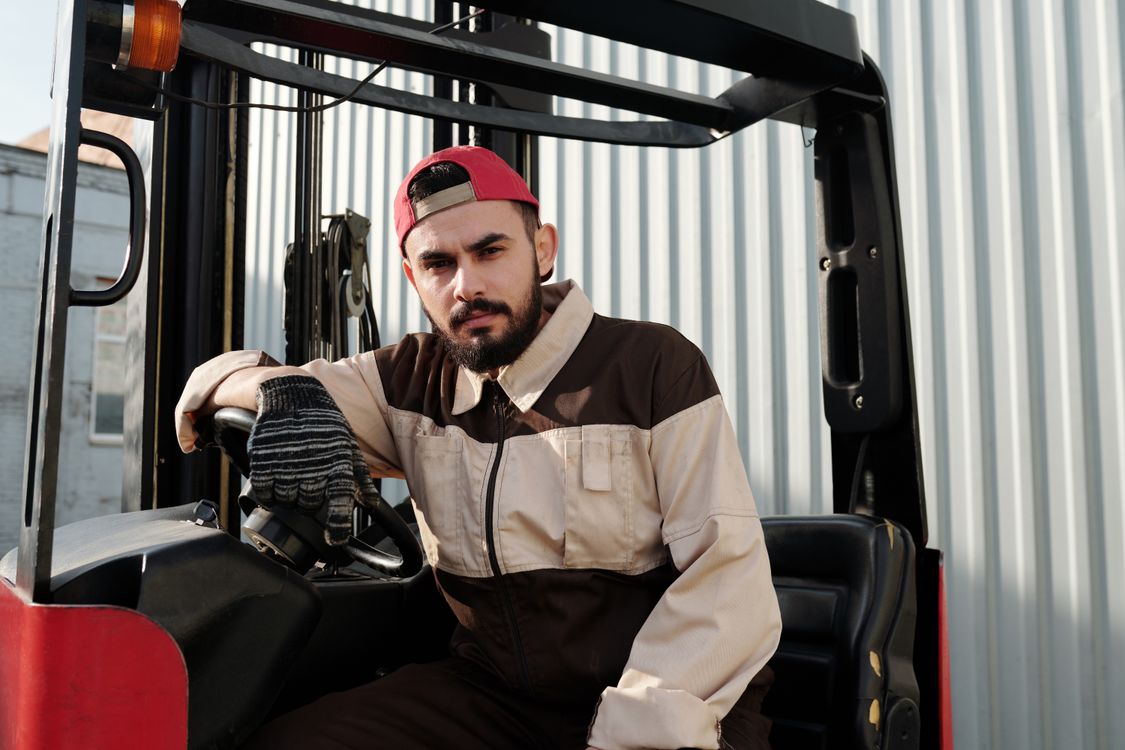 Close Up Photo of Forklift Operator · Free Stock Photo