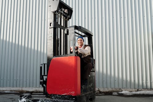Free Man Operating Forklift  Stock Photo