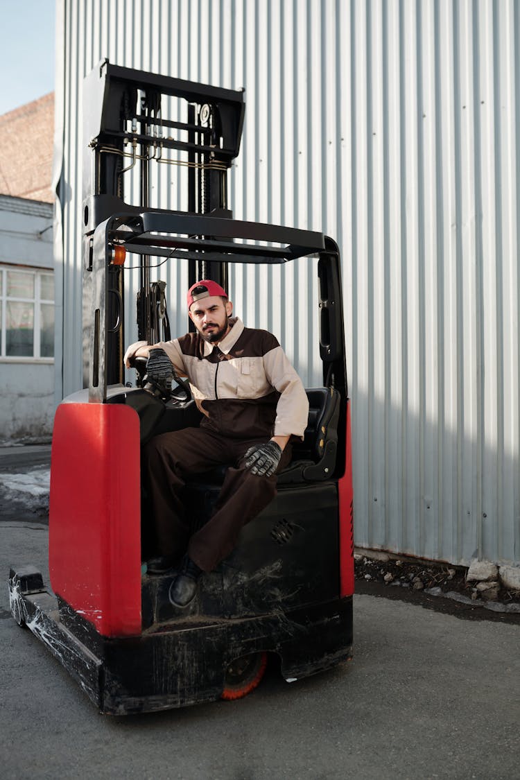 Man Sitting On A Forklift 