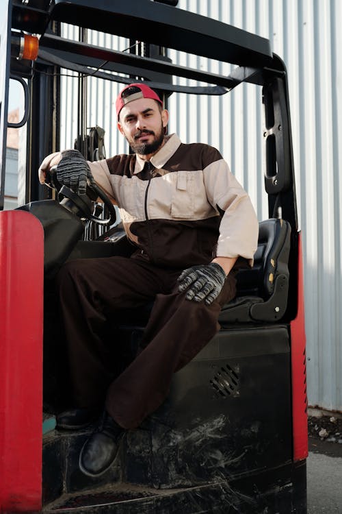 Man Seated on a Heavy Equipment 