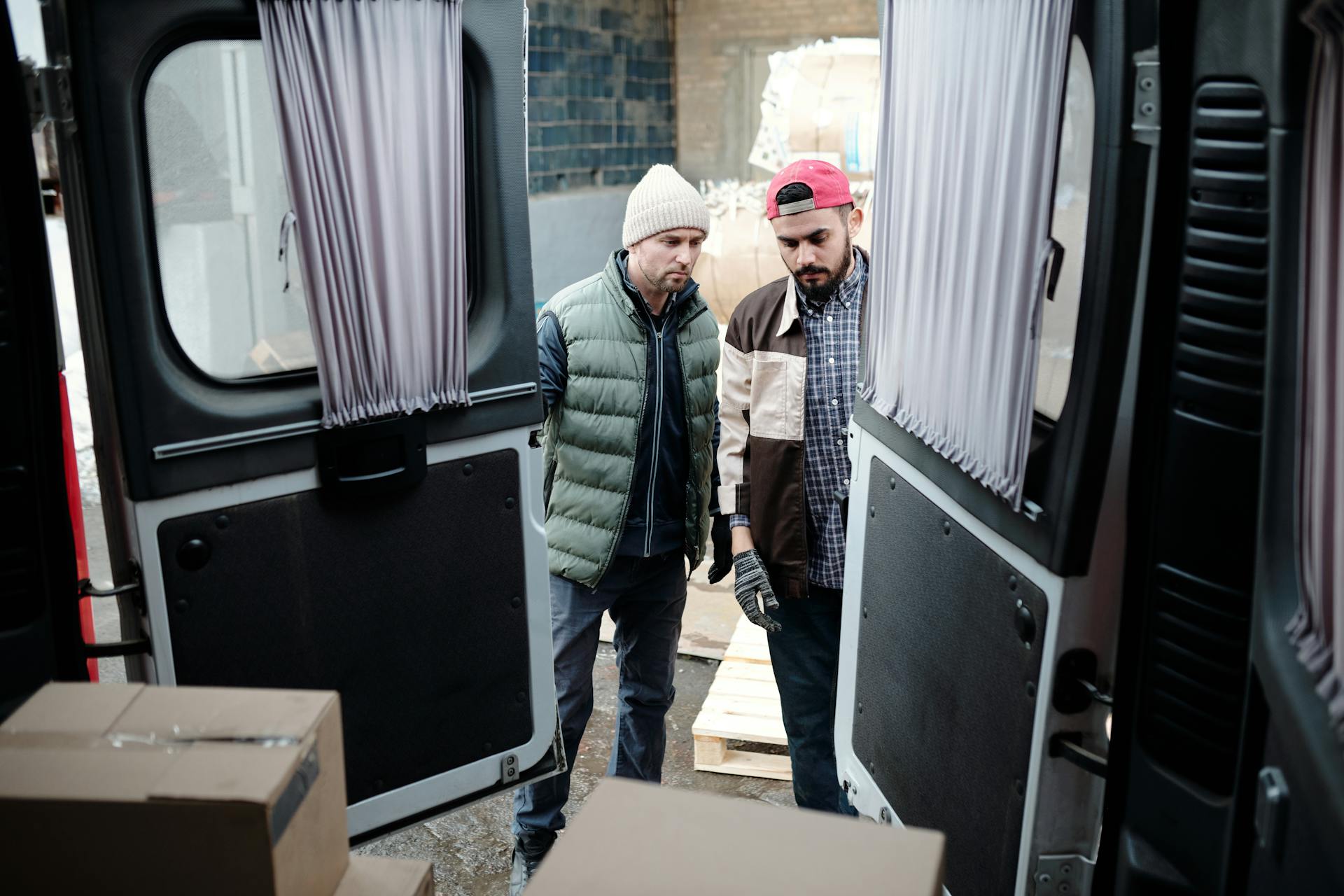 Men Opening Doors of a Van