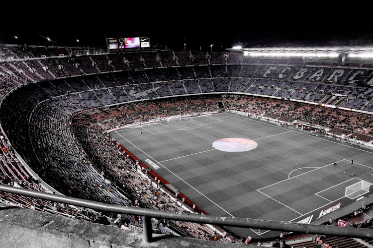 Modern Football Stadium With Spectators On Tribunes