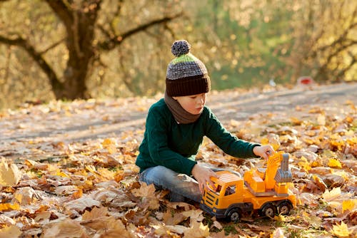Free Boy Playing with a Toy Stock Photo
