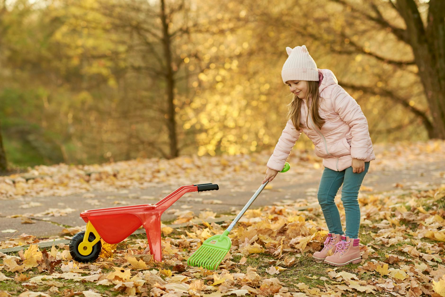 Raking autumn leaves in a yard
