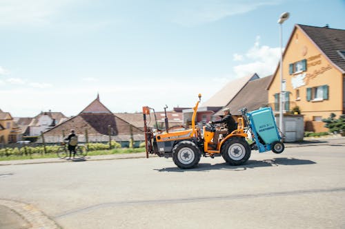 Man Riding on Yellow Heavy Equipment