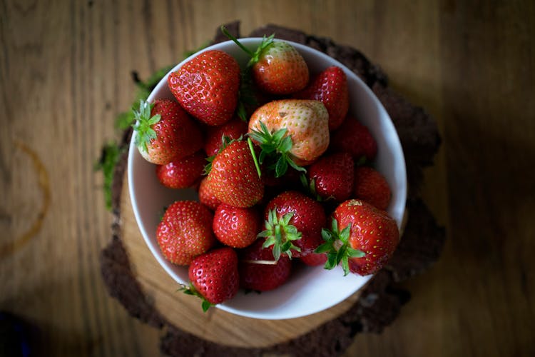 Fresh Ripe Strawberries In Bowl On Wooden Table