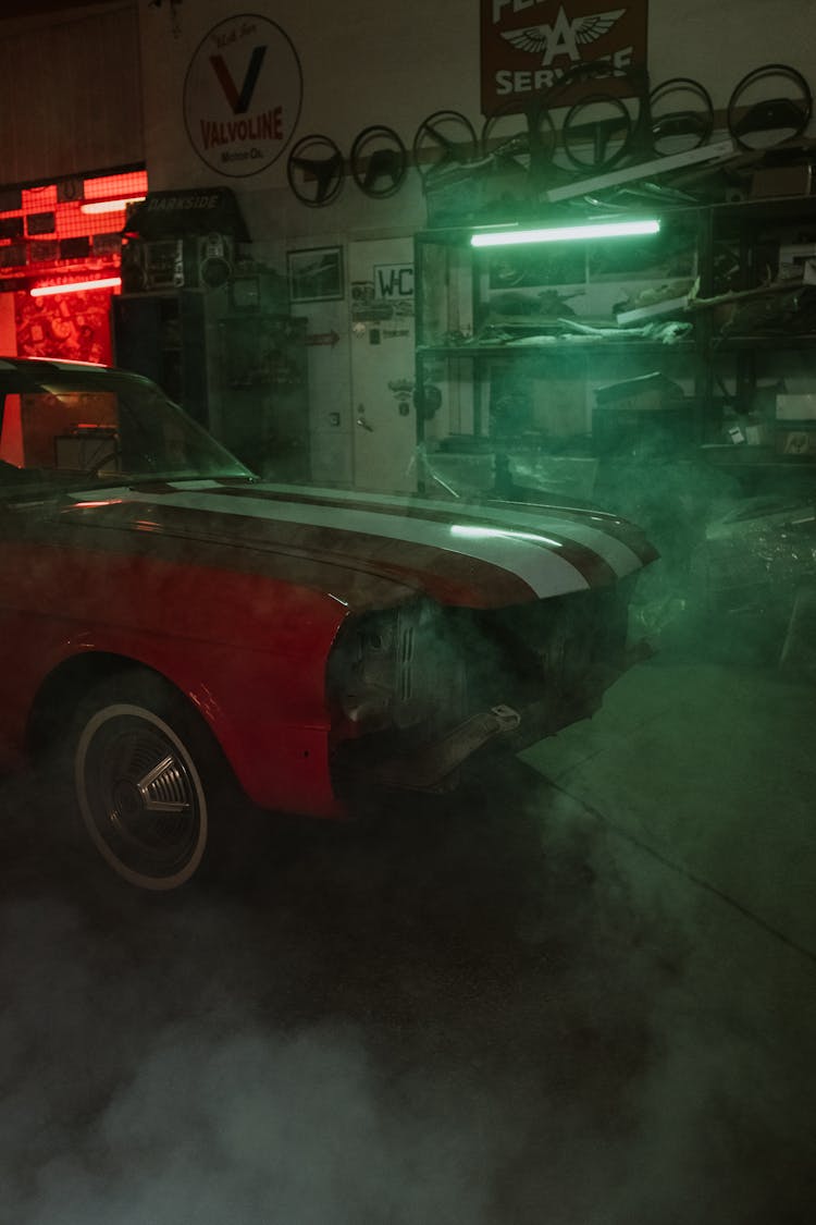 Red Car Parked In Front Of Store