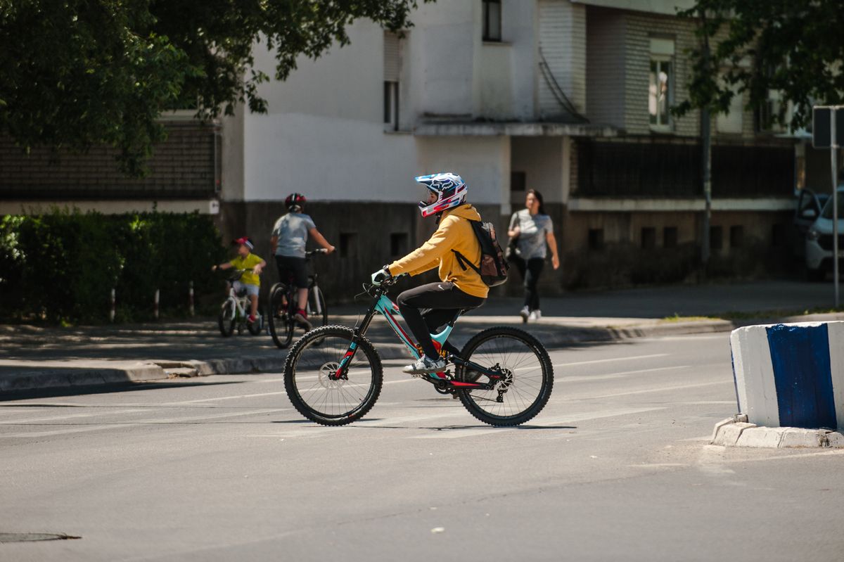 Cyclist riding through a city with practical cycling gear