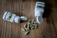 Plastic containers placed near different pills