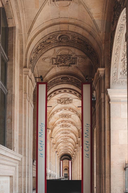 Perspective view of ornamental archway of palace with classic stucco work on sunny day