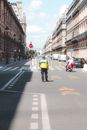 Unrecognizable traffic police officer on road