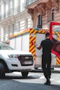 Policeman standing on roadway helping driver