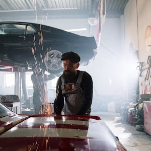 Mechanic examining car parts